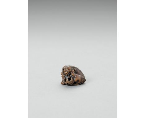   MASAMITSU: A BOXWOOD NETSUKE OF A SHISHI WITH CUB AND BROCADE BALL  By Masamitsu, signed Masamitsu  Japan, 19th century    