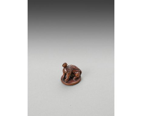  A WOOD NETSUKE OF A SUISEI  Unsigned  Japan, 19th century    Carved as a suisei, a mythical creature with a flaming mane an