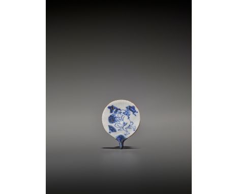   AN UNUSUAL AND RARE FAN-SHAPED BLUE AND WHITE PORCELAIN SHUNGA NETSUKE  Unsigned  Japan, 19th century, Edo period (1615-186