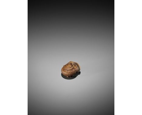   TADATOSHI: A WOOD NETSUKE OF A SNAIL  Inscribed Tadatoshi    Carved as a snail with its feelers extended over it shell, the