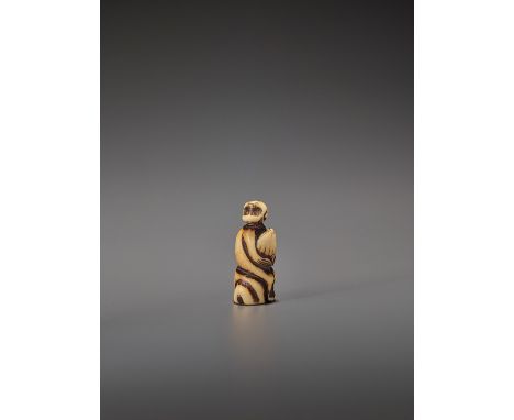   A STAG ANTLER NETSUKE OF A MONKEY WITH CHESTNUT  Unsigned  Japan, 18th century, Edo period (1615-1868)    Carved from a tub