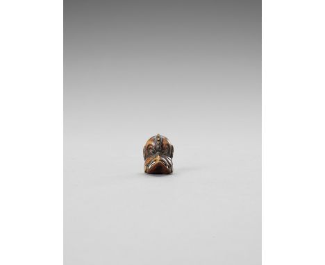   A WOOD NETSUKE OF A TENGU MASK  Signed  Japan, 19th century    The tengu mask with a fierce expression and with a ball insi
