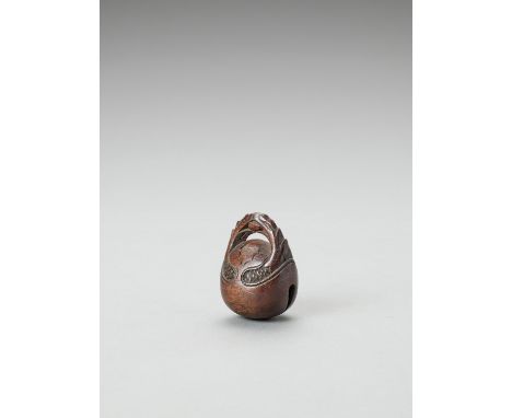   A WOOD NETSUKE OF A MOKUGYO  Unsigned  Japan, Edo period (1868-1912), 19th century    Finely carved as a mokugyo (temple be