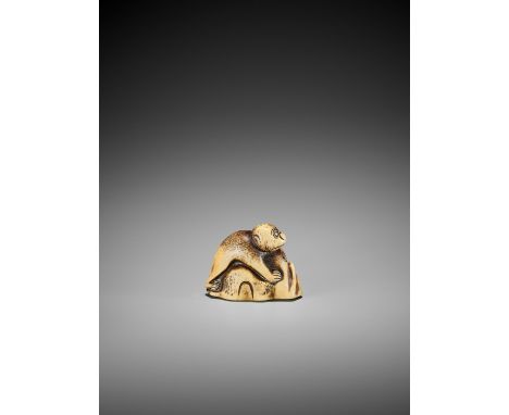   A STAG ANTLER NETSUKE OF A MONKEY ON A ROCK  Unsigned  Japan, 18th century, Edo period (1615-1868)    An early stag antler 