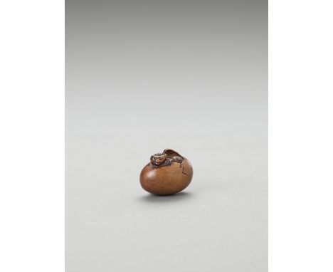  A WOOD NETSUKE OF TENGU NO TOMAGO  Signed  Japan, early 19th century, Edo period (1615-1868)    Carved with a tengu wearing