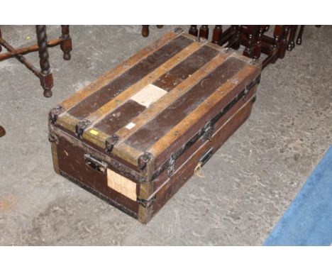 Metal bound trunk with carrying handles, 32 cm tall, 82 cm long, 44 cm deep 