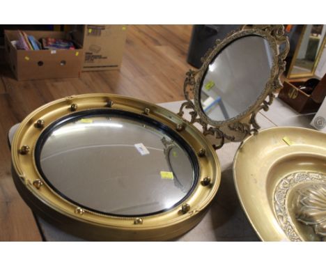 Brass framed easel back oval mirror and circular convex mirror