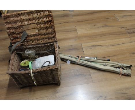 Bundle of fishing rods and vintage hamper basket of tackle