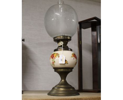 Oil lamp with ceramic floral patterned reservoir, etched shade and chimney  