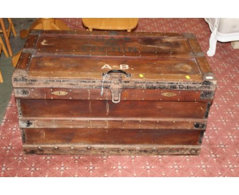 Late 19th/early 20th century travelling trunk with name to top, height 55 cm, width 106 cm, depth 58 cm