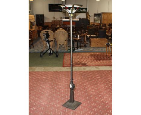 Modern metal floor lamp with Tiffany style glass shade 