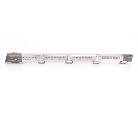 A Lionel 0 Gauge electric 3-rail 'Flying Yankee' 4-car Diesel Train, the motor coach with metallic grey cab unit and tail sec