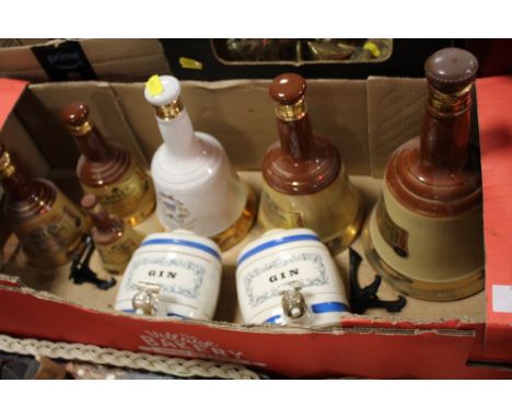 A QUANTITY OF WADE WHISKEY DECANTERS 