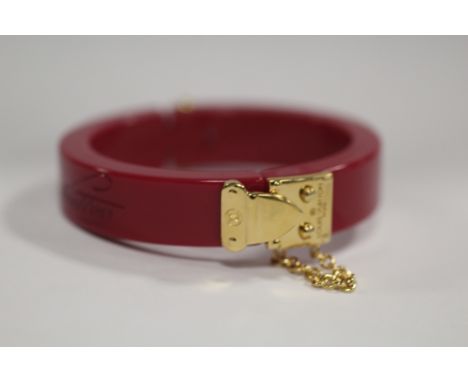 LOUIS VUITTON - A RESIN 'LOCK ME' HINGED BANGLE, with original box and Louis Vuitton drawstring bag