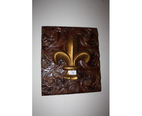 A MODERN CERAMIC FLEUR DE LYS PLAQUE