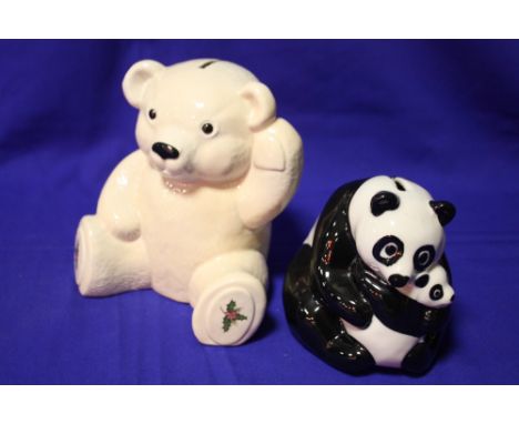 A WADE MONEY BANK IN THE FORM OF A PANDA WITH CUB TOGETHER WITH A TEDDY BEAR SHAPED EXAMPLE