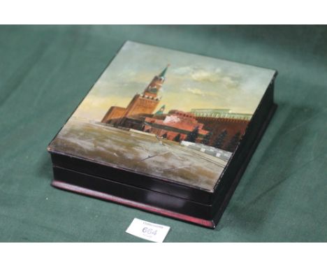 A VINTAGE HAND PAINTED LACQUERWARE LIDDED BOX DEPICTING RUSSIAN BUILDINGS, TOGETHER WITH A SILVER GREETINGS PLAQUE FROM MOSCO