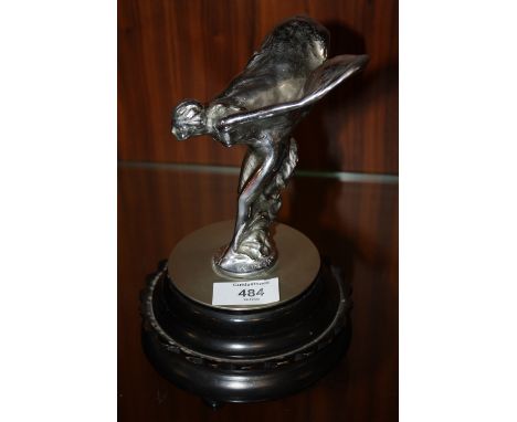 A VINTAGE CHROMED STATUETTE / CAR MASCOT OF 'THE SPIRIT OF ECSTASY',  raised on a circular base, statuette H 13 cm, overall H