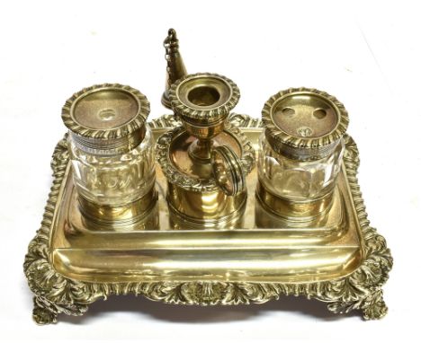 A GEORGIAN SMALL SILVER INKSTAND With two silver topped glass ink bottles with central taper stick, the rectangular four foot