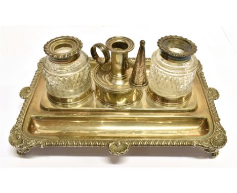 A GEORGIAN SILVER INKSTAND With three central round holders comprising two clear cut glass ink bottles and a central wax tape