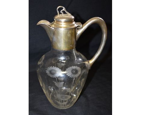 A SILVER MOUNTED GLASS CLARET JUG The plain silver mounts hallmarked Birmingham 1900, makers mark for W Hutton &amp; Sons, th