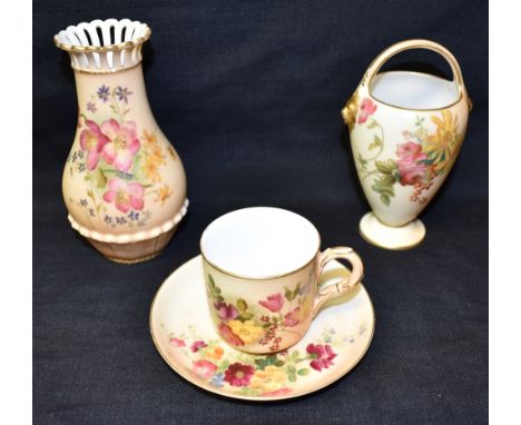 THREE ROYAL WORCESTER BLUSH IVORY ITEMS:  a cup and saucer, date code for 1917; a vase with pierced rim, date code for 1906; 