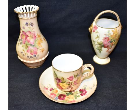 THREE ROYAL WORCESTER BLUSH IVORY ITEMS:  a cup and saucer, date code for 1917; a vase with pierced rim, date code for 1906; 