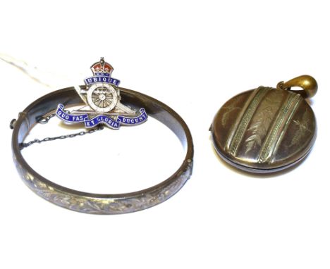 TWO ITEMS OF SILVER JEWELLERY  Comprising a Royal Artillery enamelled sweetheart brooch and a hinged bangle; together with a 