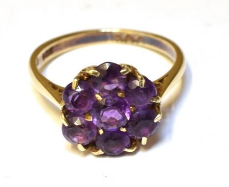 AN AMETHYST CLUSTER 9CT YELLOW GOLD DRESS RING  Ring size J ½, gross weight approx. 2.3g