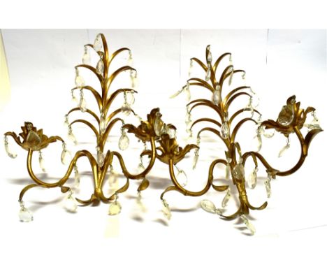 A PAIR OF TWO LIGHT GILT METAL WALL MOUNTED CANDLESTANDS  with facetted drops, 48cm high