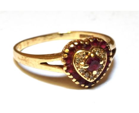 A RUBY AND DIAMOND HEART SHAPED CLUSTER RING  Yellow gold claw settings, split shoulders to a hallmarked 9ct gold shank, ring