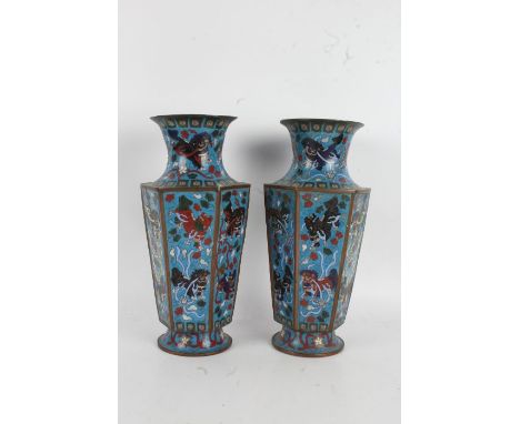 Pair of Chinese cloisonne vases, with waisted necks above tapering hexagonal bodies, the light blue ground with dog of foo de