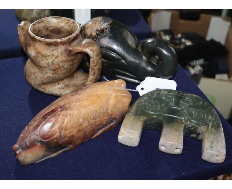 Four Chinese archaistic jade or hardstone zoomorphic carvings, including a pig, elephant head, a ewer etc. largest, elephant 