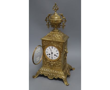 A cased brass mantel clock height 47cm