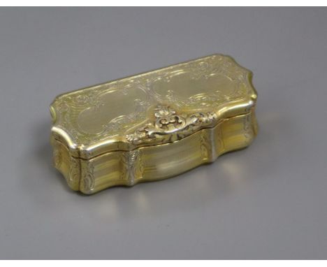 A 19th century Austrian gilt white metal snuff box of shaped rectangular form, engraved and engine-turned, Vienna 1847, 92mm.