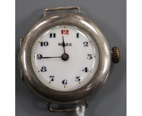 An early 20th century silver Rolex manual wind wrist watch with detached sterling flexible bracelet strap.