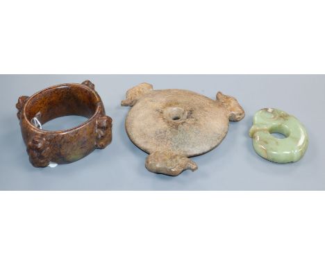 Three Chinese archaistic jade or hardstone zoomorphic carvings, including a bi disc, a ring and a huang 9.7cm - 18cm