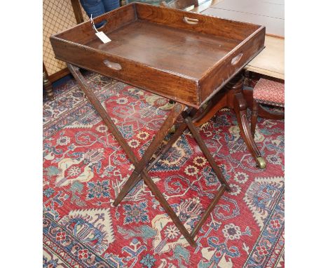 A Victorian mahogany butler's tray on folding stand W.68cm