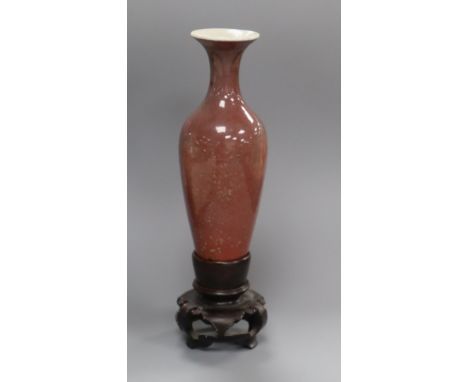 A Chinese sang de boeuf glazed small vase, Kangxi mark but Republic period, H. 18.5cm including wood standProvenance - The pr