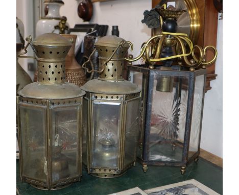 An engraved glass hexagonal hall lantern and two other lanterns