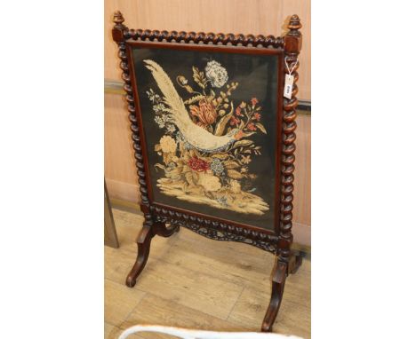 A Victorian mahogany needlepoint firescreen H.182cm