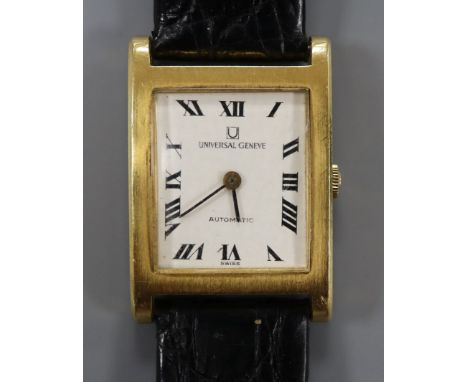 An 18ct yellow metal Universal manual wind rectangular dress wrist watch, with Roman dial, on later associated strap.