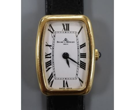 A lady's 18ct yellow metal Baume &amp; Mercier manual wind wrist watch, with Roman dial.