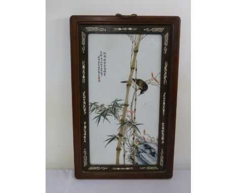 A 20th century Chinese hand painted porcelain panel with images of birds and bamboo in hardwood frame, old label to verso - 6