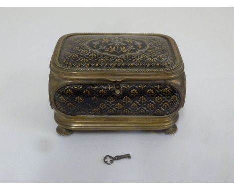 Enamel and gilt metal casket with hinged cover on four bun feet with key