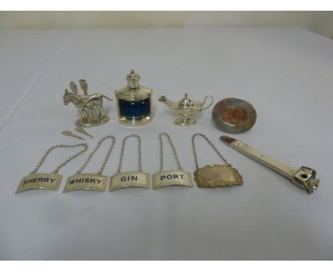 A quantity of silver and white metal to include sherry labels, a miniature lamp, an inkwell in the form of a ships lamp, a to