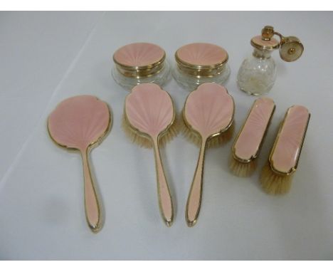 Silver and pink enamel dressing table set to include brushes, hand mirror, dressing table jars and an atomiser