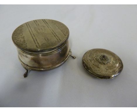 Silver jewellery box with hinged cover on three claw feet and a white metal compact