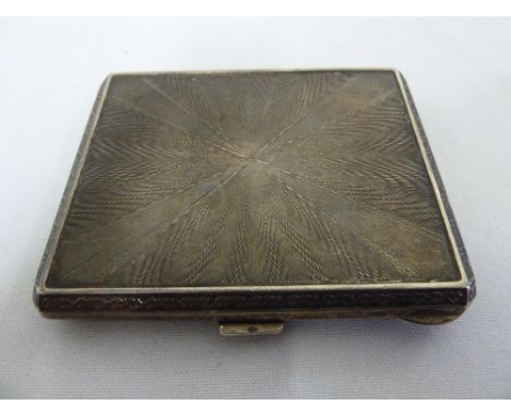 Silver cigarette case with engine turned hinged cover