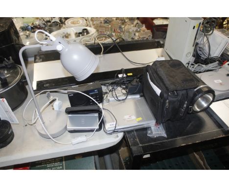 A DS; a table lamp; a Logic radio; a Goodmans DVD player and a torch